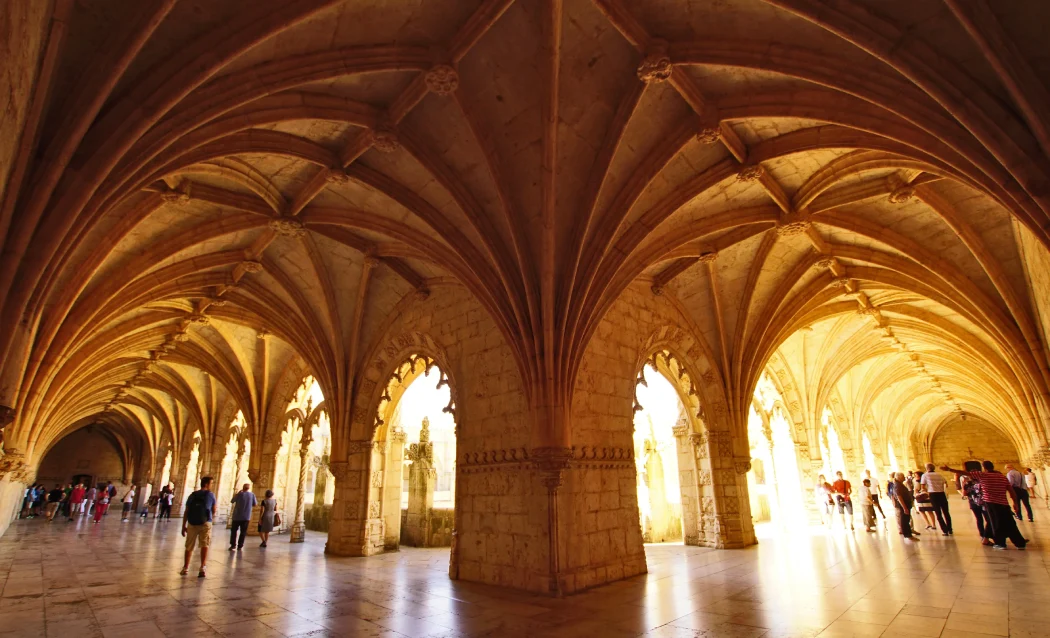 Tourists admiring the cloisters at the monument