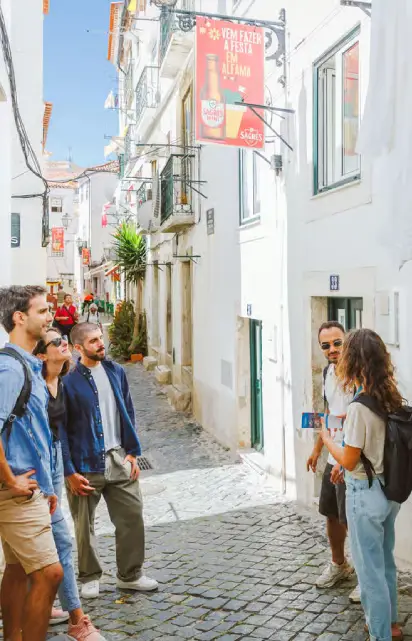 Tourists are enjoying their walking tour in Lisbon
