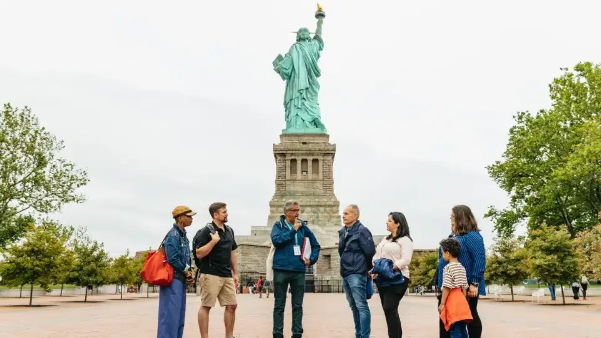 Statue of Liberty guided tour A guide and a group of visitors in the Guided tour of Liberty Island