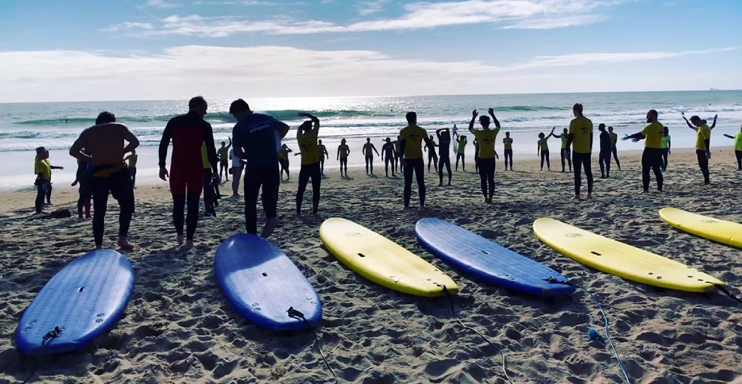 Tourists taking surf lessons in Lisbon surf school